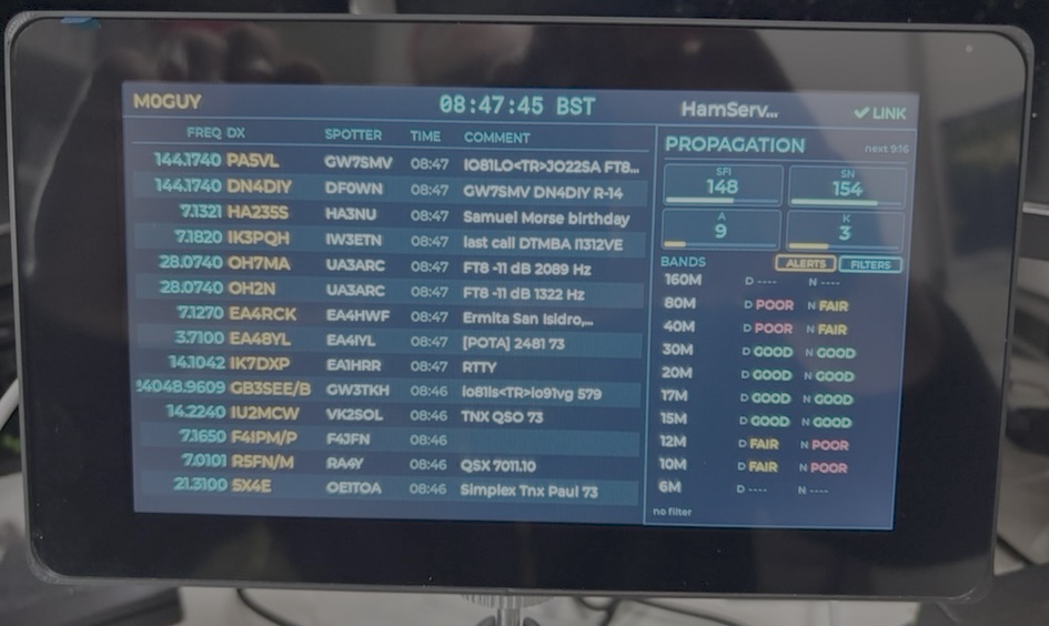 DX Spotter Pro 7-inch display showing live DX spots and a propagation panel